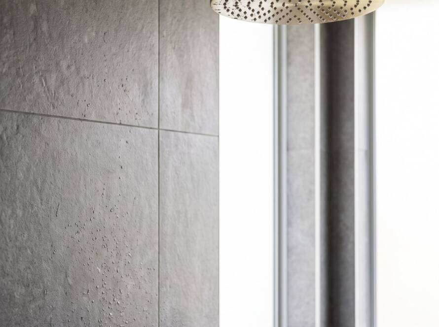 Modern bathroom with textured stone tiling